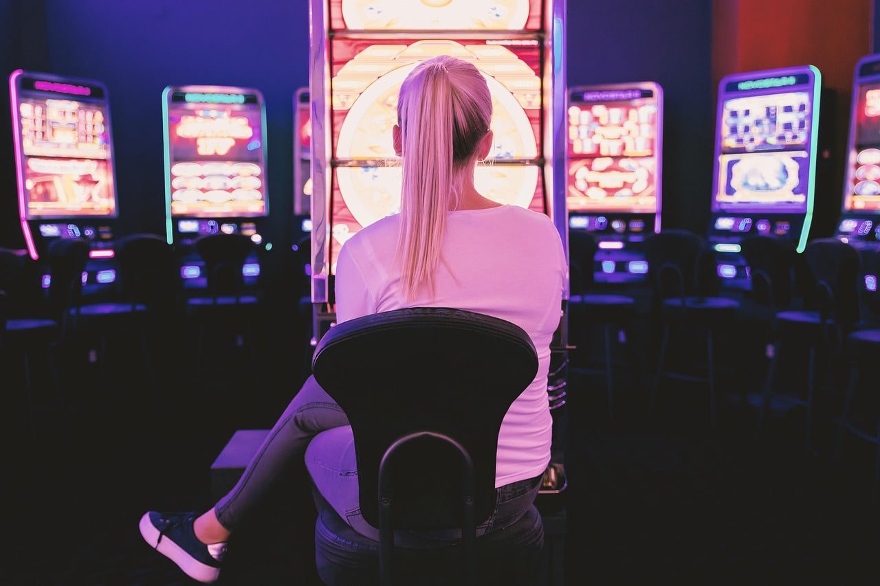 Mobile phone showing 7game5 platform interface with sports betting and casino categories